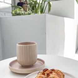 Perry’s Porch - Front patio seat with a caramel cortado and pecan pastry