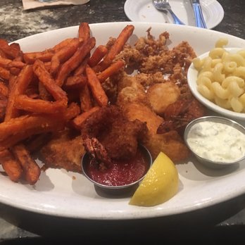 Off The Hook - Captains platter with fried halibut, shrimp, scallops and oysters with a side of garlic butter noodles and sweet potato fries - Seafood Near Me - Los Alamitos, California Off The Hook - Captains platter with fried halibut, shrimp, scallops and oysters with a side of garlic butter noodles and sweet potato fries - Seafood Near Me - Los Alamitos, California