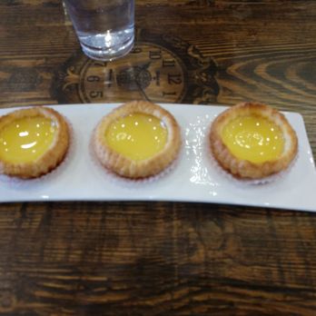 King Wah - Egg Tart, flaky, kinda crispy skin not baked enough so a bit mushy in the middle. Just sweet enough for my liking. - Dim Sum Near Me - Pleasanton, California King Wah - Egg Tart, flaky, kinda crispy skin not baked enough so a bit mushy in the middle. Just sweet enough for my liking. - Dim Sum Near Me - Pleasanton, California