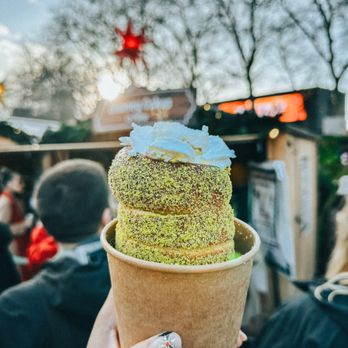 Seattle Christmas Market - Chimney cake (pistachio with custard - the custard filling made the inside very doughy) comes with a random marshmallow and whipped cream - Public Markets Near Me - Seattle, Washington Seattle Christmas Market - Chimney cake (pistachio with custard - the custard filling made the inside very doughy) comes with a random marshmallow and whipped cream - Public Markets Near Me - Seattle, Washington