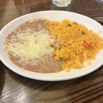 Takiza Mexican Cuisine - Rice and beans side - Mexican Near Me - Oshkosh, Wisconsin Takiza Mexican Cuisine - Rice and beans side - Mexican Near Me - Oshkosh, Wisconsin