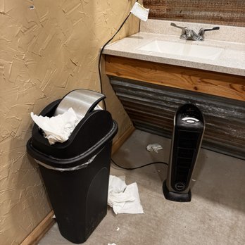 The Grain - Overflowing trash next to sink and heater plugged in under sink next to paper trash - Bars Near Me - Hamilton, Texas The Grain - Overflowing trash next to sink and heater plugged in under sink next to paper trash - Bars Near Me - Hamilton, Texas