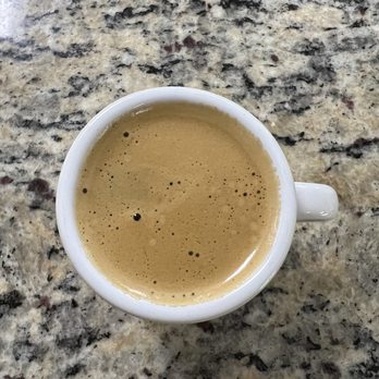 Bakery 186 - a cup of coffee on a granite countertop - Bakeries Near Me - Hialeah, Florida