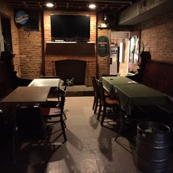 Quigley's Half-Irish Pub - a fireplace and tables - Irish Pub Near Me - Baltimore, Maryland Quigley's Half-Irish Pub - a fireplace and tables - Irish Pub Near Me - Baltimore, Maryland