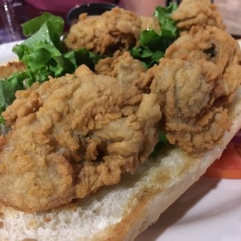Wolf Bay Restaurant - Foley - Fried oyster poboy with a side of remoulade sauce. - Seafood Near Me - Foley, Alabama Wolf Bay Restaurant - Foley - Fried oyster poboy with a side of remoulade sauce. - Seafood Near Me - Foley, Alabama