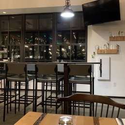 Seat in the bar. Poor dying plants on the wall. Seat in the bar. Poor dying plants on the wall.