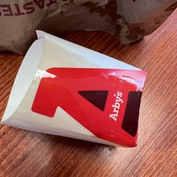 Arby's - Cardboard container potato cakes come in.