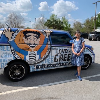 The Hungry Greek - Dimitra next to Hungry Greek van - Greek Near Me - Lutz, Florida The Hungry Greek - Dimitra next to Hungry Greek van - Greek Near Me - Lutz, Florida