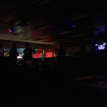 Nara Hookah Lounge - a group of people in the dark - Hookah Bars Near Me - Denver, Colorado