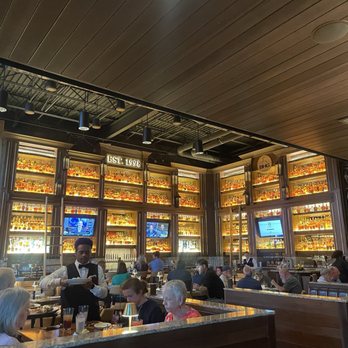 Malone's - The impressive wall of spirits offers an amazing backdrop for all photos! - Steakhouses Near Me - Chattanooga, Tennessee