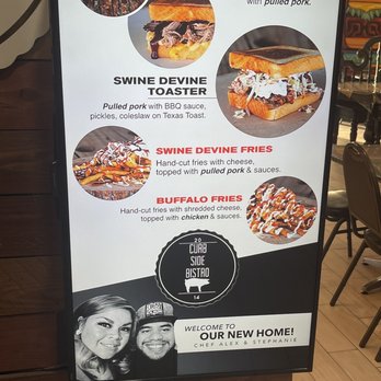 Curb Side Bistro - Colorful monitors showing great pics of the sliders. Notice the sweet pic of the owners at the bottom welcoming their customers. - New American Near Me - Odessa, Texas