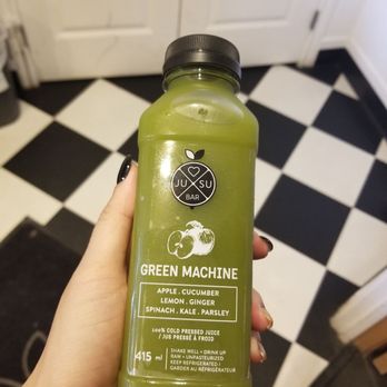 Jusu - a person holding a bottle of green juice - Juice Bars & Smoothies Near Me - Lake Louise, Alberta Jusu - a person holding a bottle of green juice - Juice Bars & Smoothies Near Me - Lake Louise, Alberta