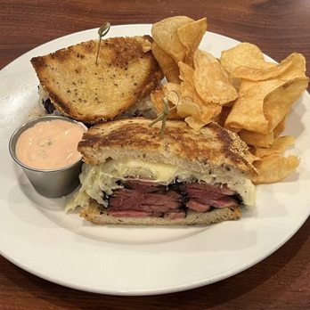 Factor's Famous Deli - Pastrami Reuben with handmade chips - Delis Near Me - Los Angeles, California Factor's Famous Deli - Pastrami Reuben with handmade chips - Delis Near Me - Los Angeles, California