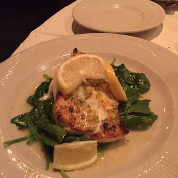 Christo's - Chilean Sea Bass in a garlic lemon sauce over wilted spinach - Italian Near Me - Phoenix, Arizona