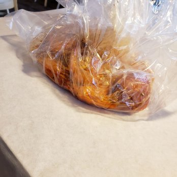 The Crab House - 1lb headless shrimp served in a bag w/potatoes corn sausage seasoning. good, messy, served w/plastic bib plastic gloves napkins paper plate - Cajun/Creole Near Me - Wheat Ridge, Colorado