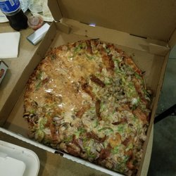 Imo's Pizza - All toppings slid to one side of the pizza.  Pizza also did not taste good.