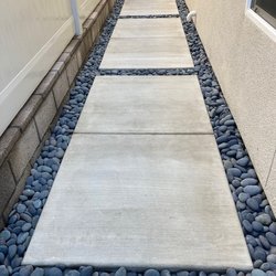 Aguilar Landscape - Side yards with concrete and Black River Pebbles