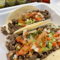 Taco Star - Carne Asada tacos with guacamole on flour tortillas