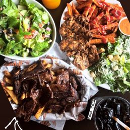 Greek salad, ribs and fries, jerk chicken entrée with sweet potato fries and Caesar salad. Greek salad, ribs and fries, jerk chicken entrée with sweet potato fries and Caesar salad.