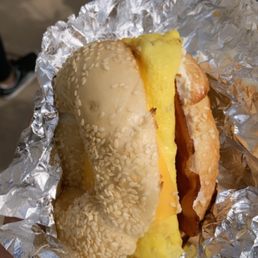 Cheese, bacon, egg on a sesame bagel.