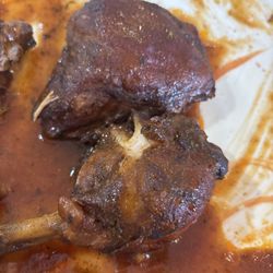 Lil’ Jamaica Sports Bar and Grill - What's left from my brown stewed chicken after eating a little more than half . The rest of the food disappeared too quickly!