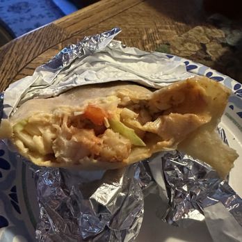 The Taco Stand - A close-up of just how packed with shrimp this burrito comes from there epic burrito #TacoStand - Mexican Near Me - Orange, California The Taco Stand - A close-up of just how packed with shrimp this burrito comes from there epic burrito #TacoStand - Mexican Near Me - Orange, California