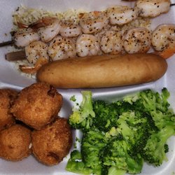 Captain D's - Shrimp Skewers on a bed of rice with Hush Puppies, Broccoli,  and Bread.