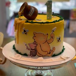 Cosmic Cakery - Winnie the Pooh and piglet 1st birthday cake.