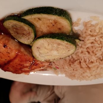 Ruby Tuesday - Salmon, rice, veggies - A meal featuring grilled chicken, sliced zucchini, and a serving of rice on a white plate. - American Near Me - Charles Town, West Virginia