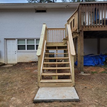 Reliable Hardscape Design - front view of new staircase with concrete pad. - Landscaping Near Me - Woodstock, Georgia Reliable Hardscape Design - front view of new staircase with concrete pad. - Landscaping Near Me - Woodstock, Georgia