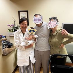 Dragon Acupuncture & Herb Center - Dr Zhao holding our little miracle