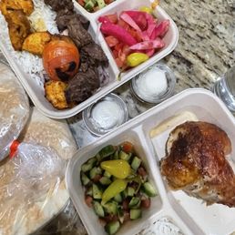 Combo Kabob Plate (top) & Quarter Dark Plate (bottom) with 2 garlic sauces & 2 packs of Pita Bread.