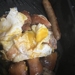Old fashioned 55+ Buttermilk Pancakes with eggs over medium () sausages and blueberry syrup. Old fashioned 55+ Buttermilk Pancakes with eggs over medium () sausages and blueberry syrup.