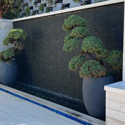 Elevation Living Walls - Waterfall. We do full landscape construction. A lot of our clients start with a living wall and we end up creating other remarkable spaces