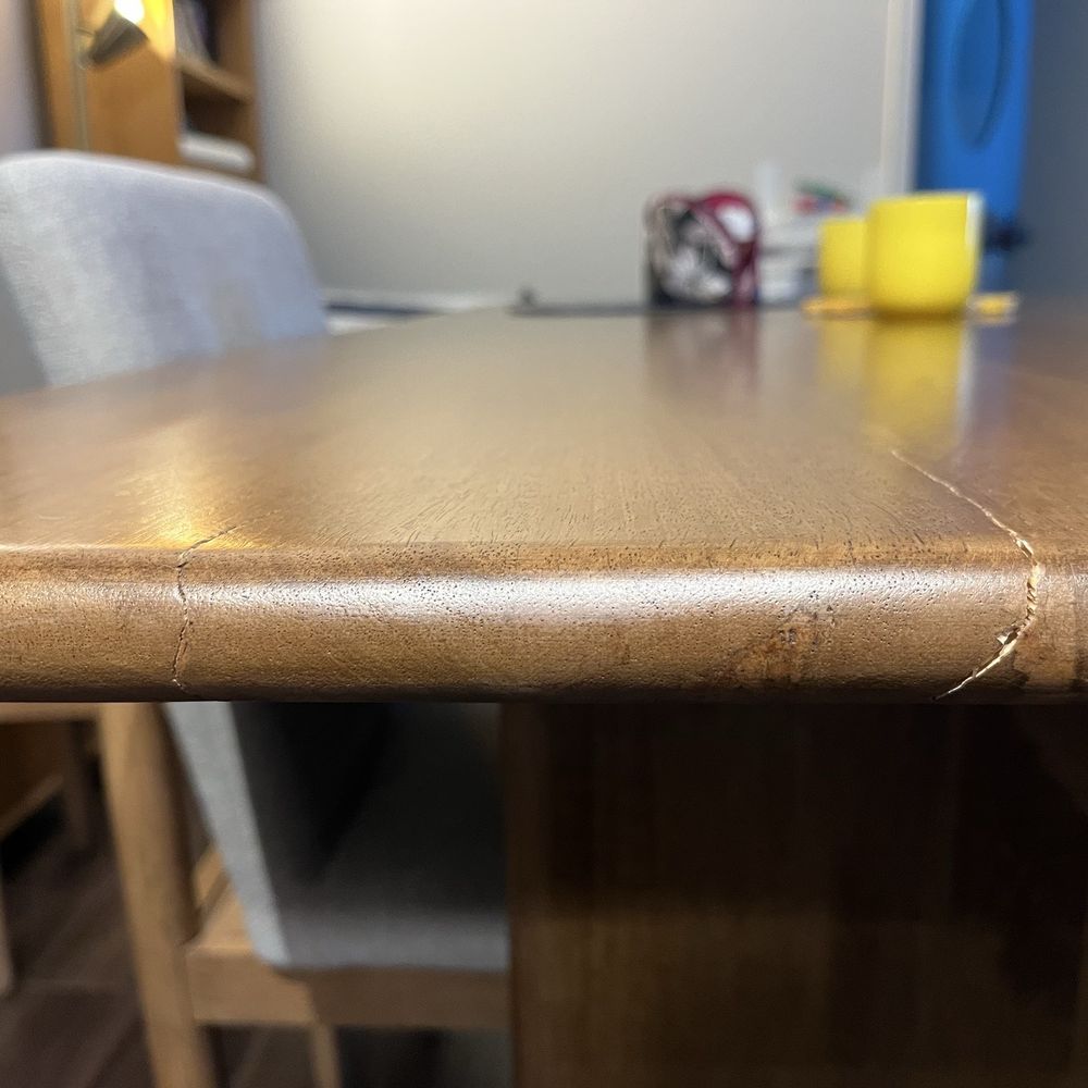 Ashley Store + Outlet - Cracked tabletop in a solid wood table - Furniture Stores Near Me - Broadview, Illinois
