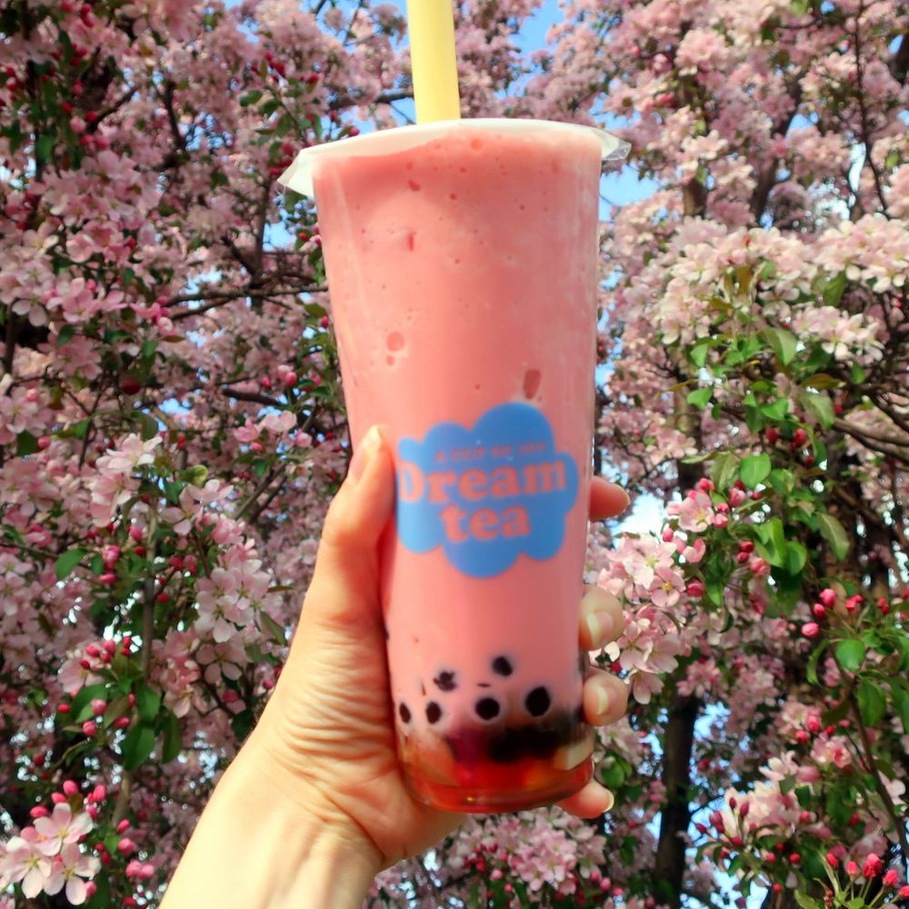 Dream Tea House - a hand holding a cup of bubble tea - Coffee & Tea Near Me - Edmonton, Alberta Dream Tea House - a hand holding a cup of bubble tea - Coffee & Tea Near Me - Edmonton, Alberta