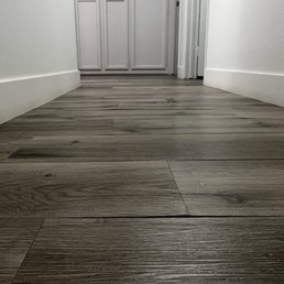 Vinyl Flooring planks lifting.