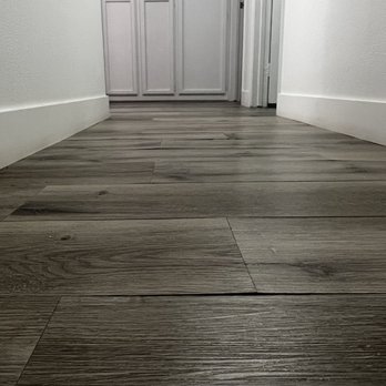 Always Improve Flooring - Vinyl Flooring planks lifting. - Flooring Near Me