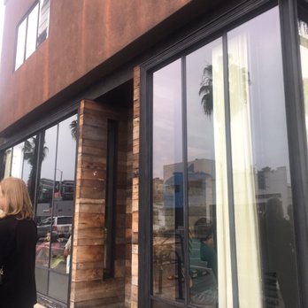 Gjelina - Outside of the restaurant, bill w/mandatory service charge, 7 top that never had 7, and the empty 2 top that stayed empty. - New American Near Me - Venice, California