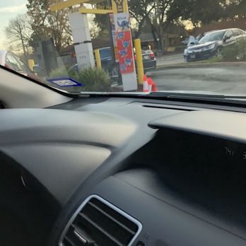 McDonald's - the dashboard of a car at a gas station - Burgers Near Me - Houston, Texas