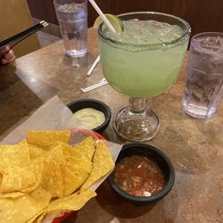 Dos Hermanos Mexican Grill & Bar - Salsa n crema with chips and a classic margarita and m the rocks.