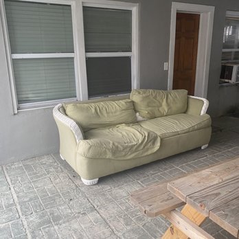 Myrtle Beach Vacation Stations - Broken nasty sofa sitting outside - Vacation Rental Agents Near Me - Little River, South Carolina