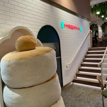 Gram Cafe & Pancakes - Fluffy pancake stack leading to the stairs - Pancakes Near Me - Sydney, NSW