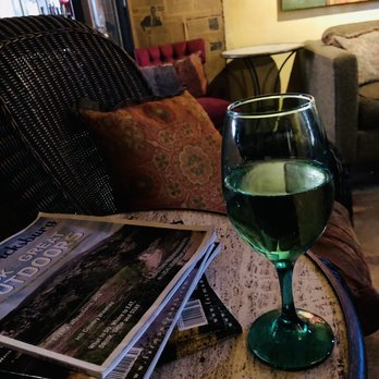 Lincoln Street - a glass of wine on a table - Wine Bars Near Me - Fredericksburg, Texas