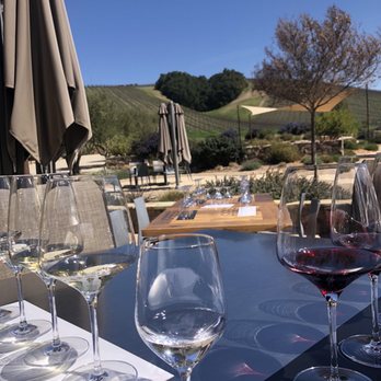 Niner Wine Estates - Our table- pre poured wines overlooking the hill. - Wine Tasting Room Near Me - Paso Robles, California Niner Wine Estates - Our table- pre poured wines overlooking the hill. - Wine Tasting Room Near Me - Paso Robles, California