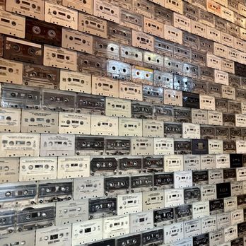 Windsor - Cassette-covered walls going to the bathrooms in the back. Do you see any of your favorite artists? - New American Near Me - Phoenix, Arizona Windsor - Cassette-covered walls going to the bathrooms in the back. Do you see any of your favorite artists? - New American Near Me - Phoenix, Arizona