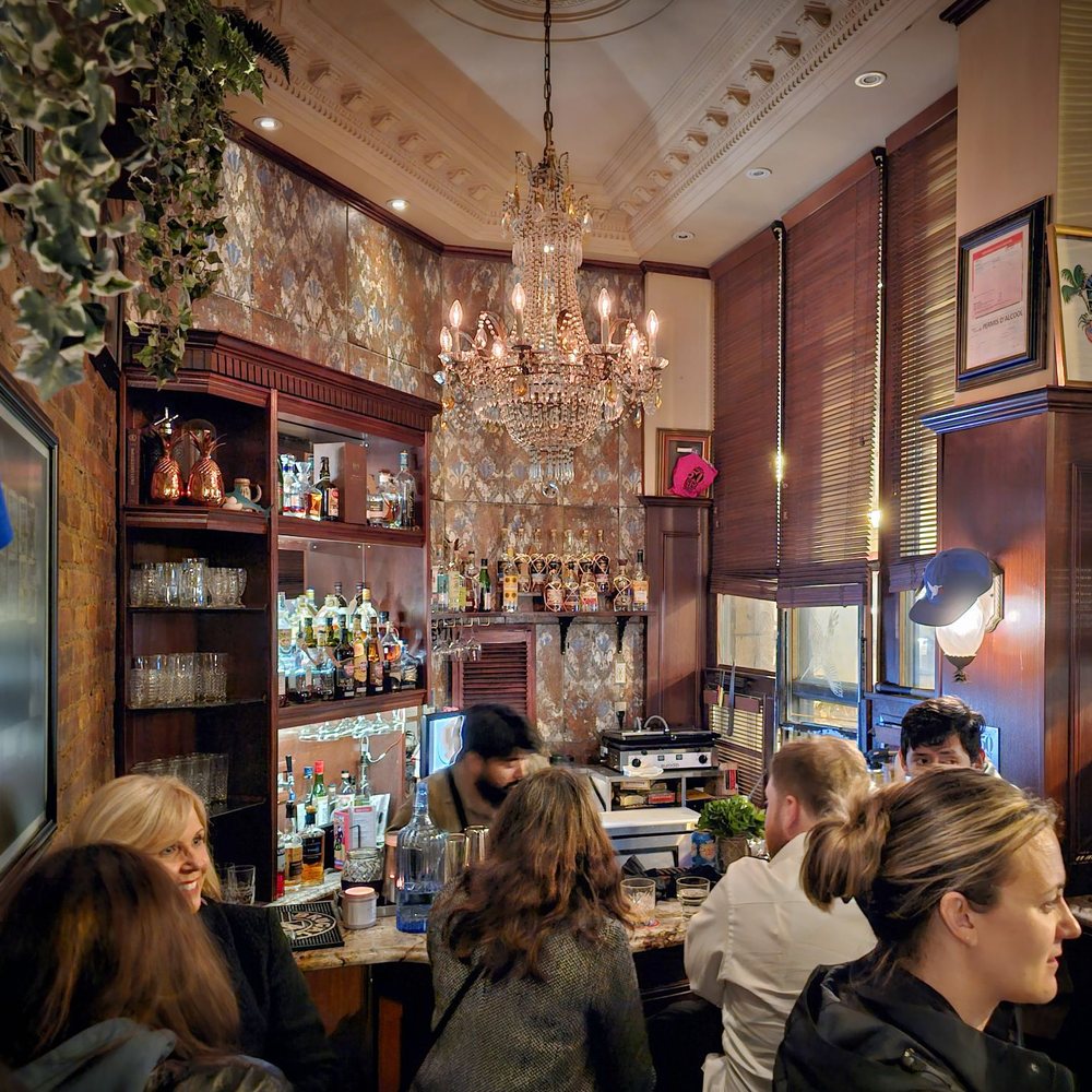 El Pequeño Bar - people sitting at the bar - Cocktail Bars Near Me - Montreal, Quebec