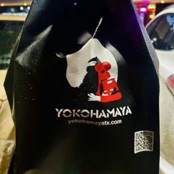 Yokohamaya - To go bag (ignore the rain) - Sushi Bars Near Me - Cypress, Texas