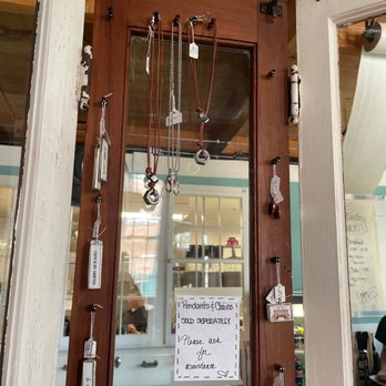 Maison de Manger - a sign in a shop window - Creperies Near Me - Whitinsville, Massachusetts