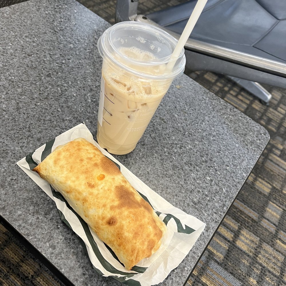 Starbucks - Iced Chai Tea Latte with oat milk and Vanilla added cinnamon sprinkled in it along with breakfast burrito. - Coffee & Tea Near Me - Columbus, Ohio Starbucks - Iced Chai Tea Latte with oat milk and Vanilla added cinnamon sprinkled in it along with breakfast burrito. - Coffee & Tea Near Me - Columbus, Ohio